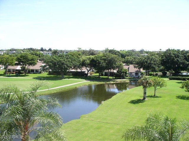 surrounding community featuring a water view and a yard