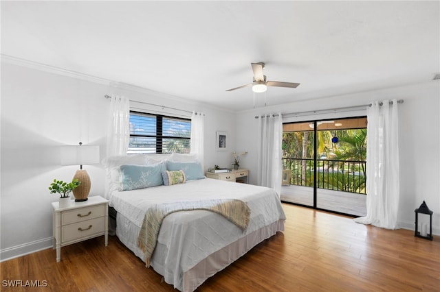 bedroom with hardwood / wood-style floors, multiple windows, crown molding, and ceiling fan