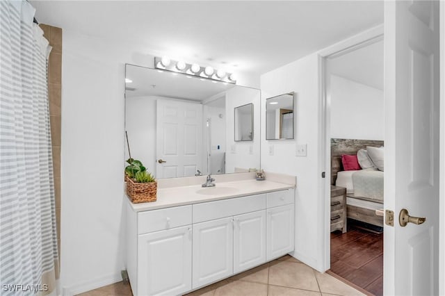 bathroom with tile patterned flooring and vanity