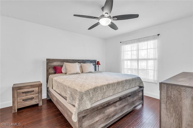 bedroom with ceiling fan and dark wood-type flooring