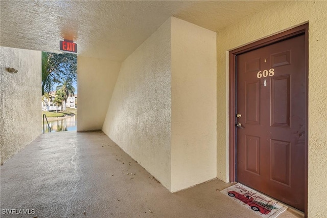 doorway to property featuring a water view