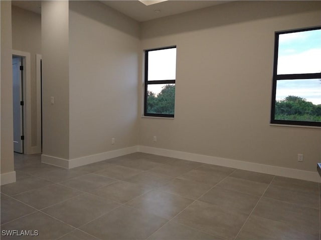 spare room with tile patterned flooring