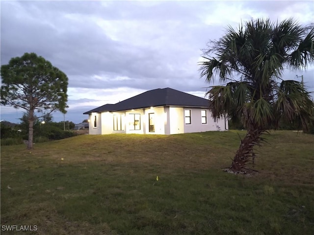 view of home's exterior with a yard