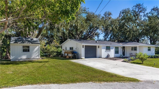 ranch-style home featuring a garage and a front yard