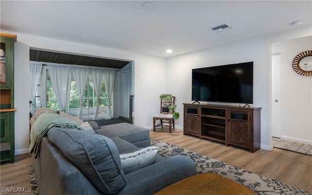 living room with light hardwood / wood-style floors