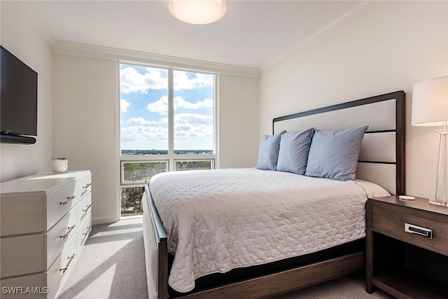 carpeted bedroom featuring multiple windows and crown molding