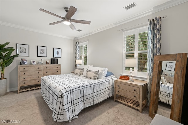 bedroom featuring crown molding, carpet floors, and ceiling fan