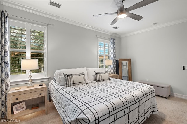 bedroom with light carpet, crown molding, and ceiling fan