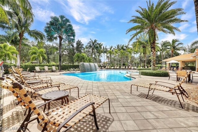 view of swimming pool featuring a patio and pool water feature