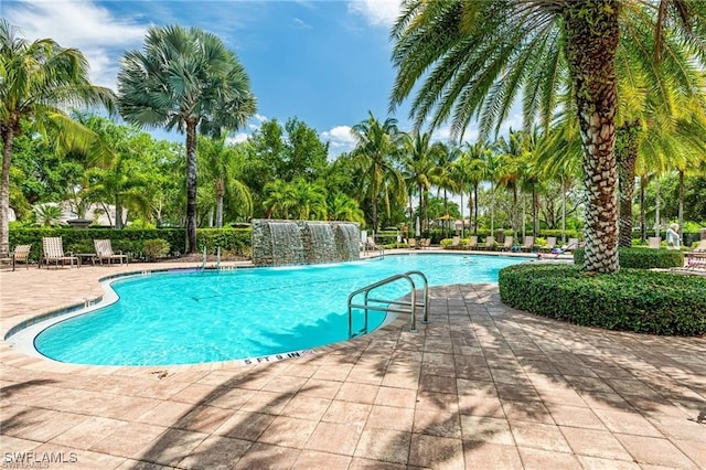 view of swimming pool featuring a patio and pool water feature