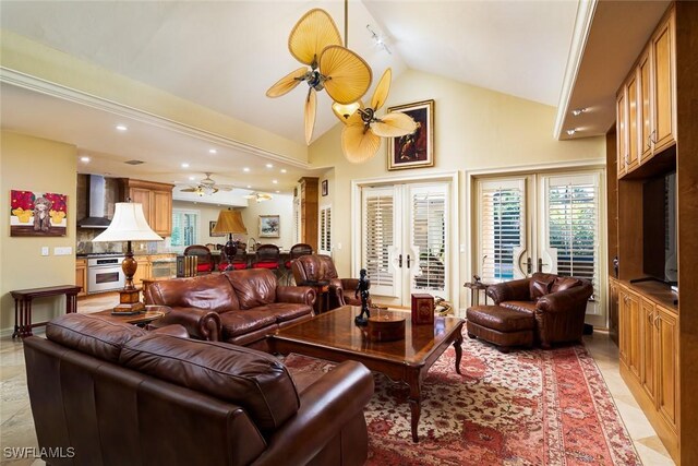 living room featuring lofted ceiling and ceiling fan