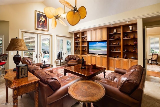 living room with light tile patterned flooring, lofted ceiling, and built in shelves