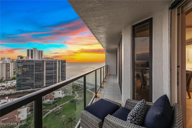 balcony at dusk with a water view