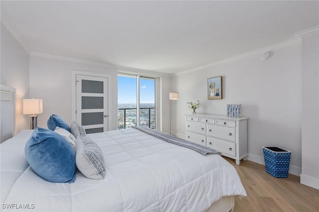 bedroom with crown molding and light wood-type flooring