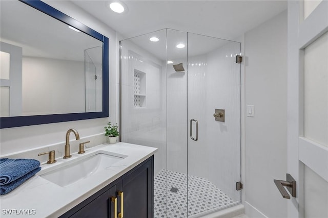 bathroom with vanity and an enclosed shower