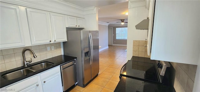 kitchen with sink, light tile patterned floors, white cabinets, stainless steel appliances, and backsplash