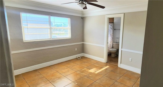 tiled empty room with crown molding and ceiling fan