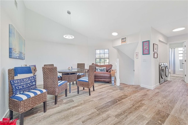 dining room featuring light hardwood / wood-style floors and washing machine and dryer