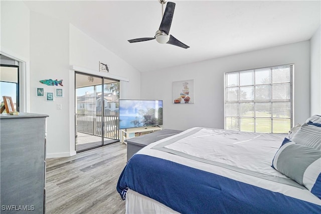 bedroom with access to exterior, wood-type flooring, ceiling fan, and lofted ceiling