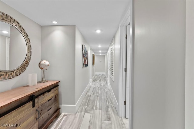 hallway with light wood-type flooring