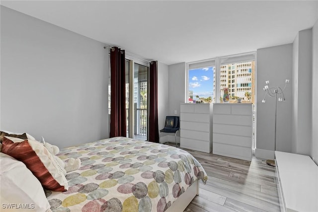 bedroom with light wood-type flooring