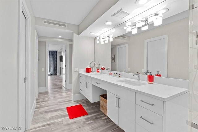 bathroom featuring vanity and hardwood / wood-style flooring