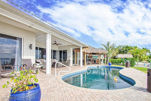 view of swimming pool with a patio area, a gazebo, and ceiling fan