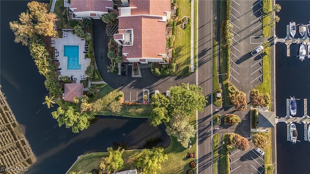 birds eye view of property with a water view