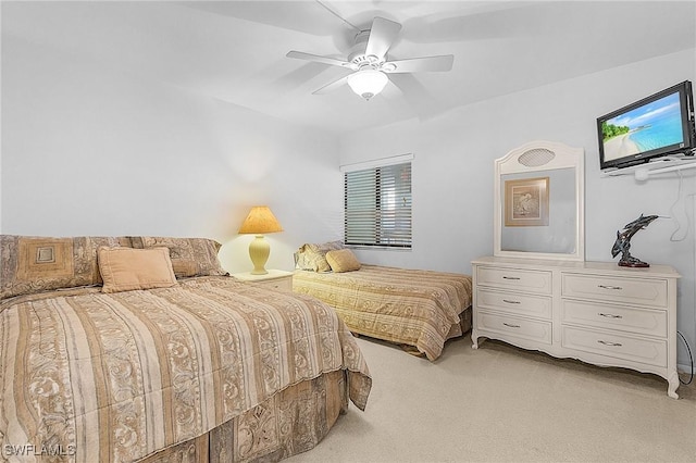 bedroom with light carpet and ceiling fan