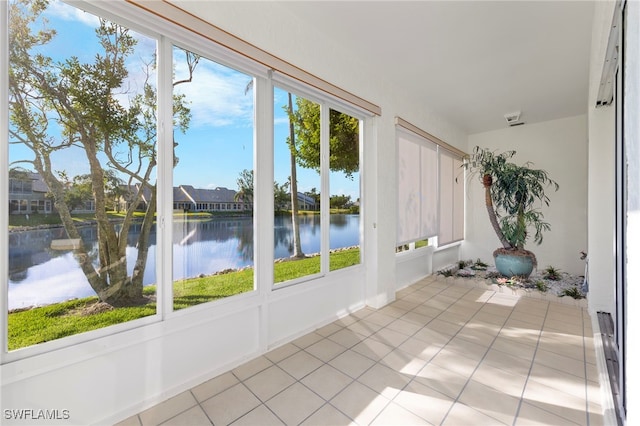 304 Mcgregor Park Cir Unit 304, Fort Myers, FL 33908 - unfurnished sunroom featuring a water view and tile patterned floors