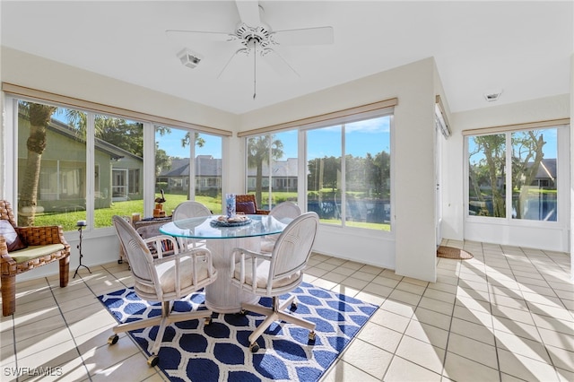 sunroom with ceiling fan and a wealth of natural light