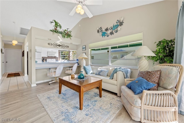 sitting room with light hardwood / wood-style flooring, ceiling fan, and lofted ceiling