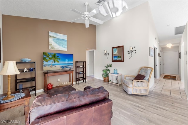 304 Mcgregor Park Cir Unit 304, Fort Myers, FL 33908 - living area featuring wood finished floors, a ceiling fan, and high vaulted ceiling