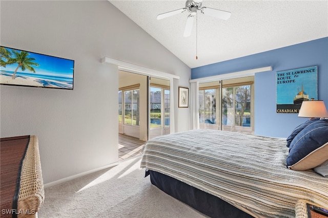 carpeted bedroom featuring a textured ceiling, access to outside, ceiling fan, and lofted ceiling