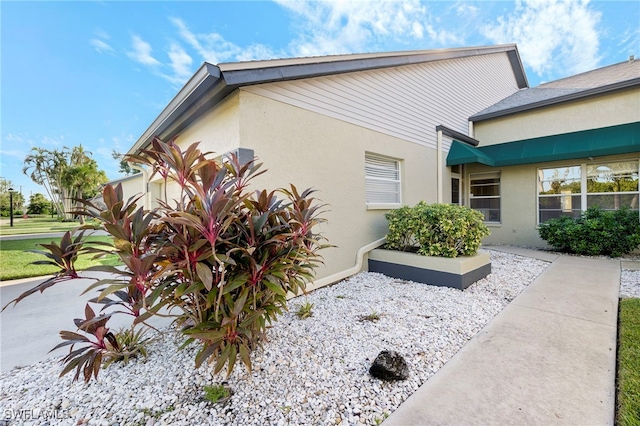 304 Mcgregor Park Cir Unit 304, Fort Myers, FL 33908 - view of home's exterior featuring stucco siding