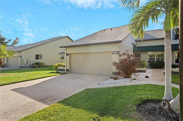 single story home featuring a front yard and a garage