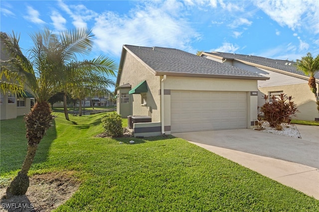 view of front facade with a garage and a front yard