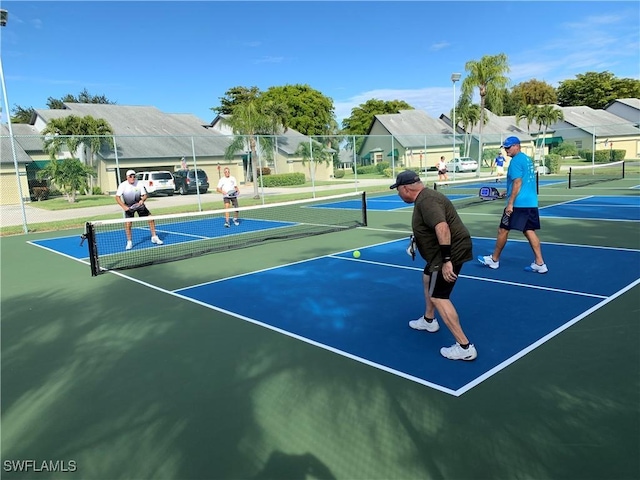 view of sport court featuring basketball hoop