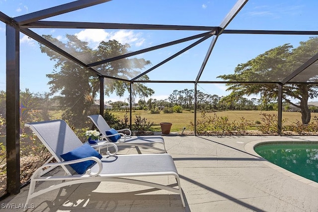 view of pool featuring a patio area and a lanai