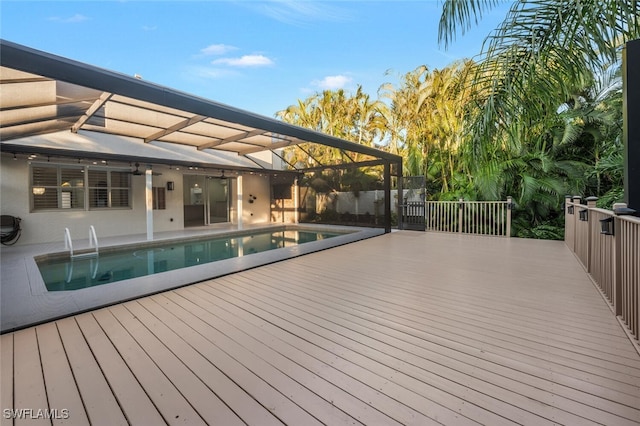 view of swimming pool with a deck