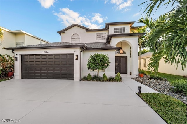 mediterranean / spanish house with a garage