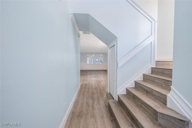 stairs featuring hardwood / wood-style flooring