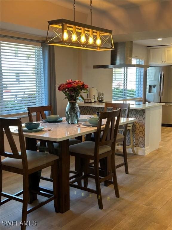 dining space featuring light hardwood / wood-style flooring