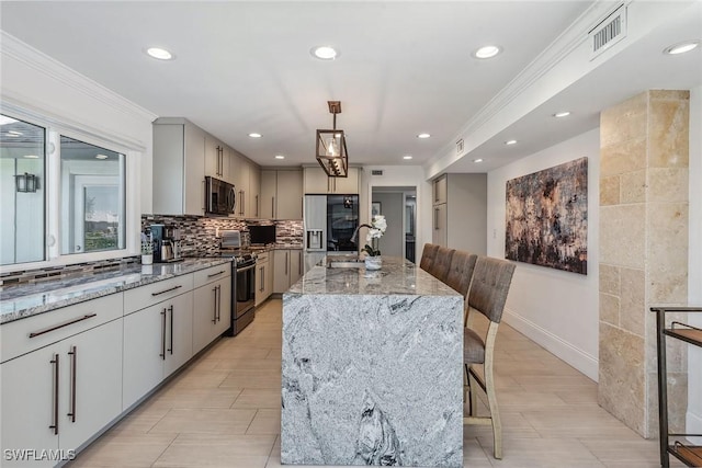 272 N Barfield Dr, Marco Island, FL 34145 - kitchen featuring stainless steel range oven, crown molding, refrigerator with ice dispenser, light stone countertops, and recessed lighting