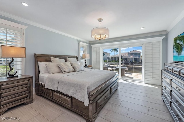 bedroom with access to exterior, crown molding, and a notable chandelier