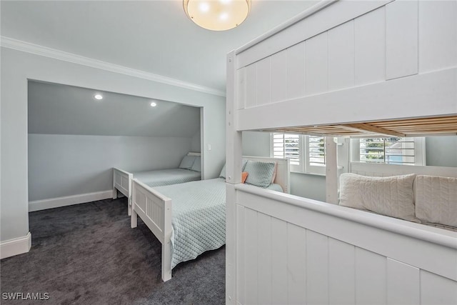 bedroom with dark colored carpet, ornamental molding, and vaulted ceiling