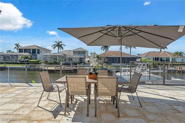 272 N Barfield Dr, Marco Island, FL 34145 - view of patio with a water view, a residential view, and outdoor dining area