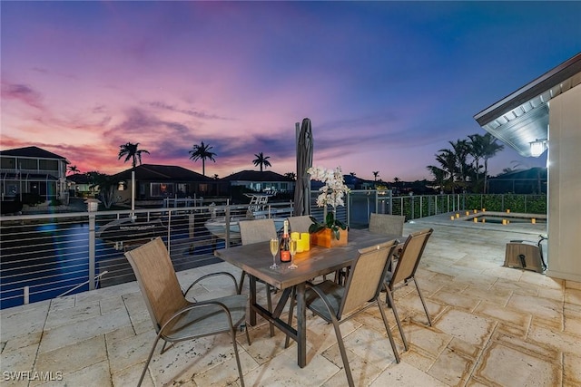272 N Barfield Dr, Marco Island, FL 34145 - patio terrace at dusk featuring a patio area and outdoor dining area