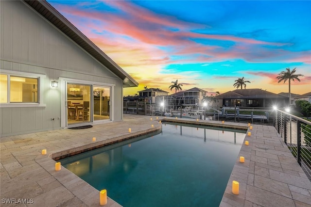 272 N Barfield Dr, Marco Island, FL 34145 - pool at dusk with an outdoor pool and a patio area