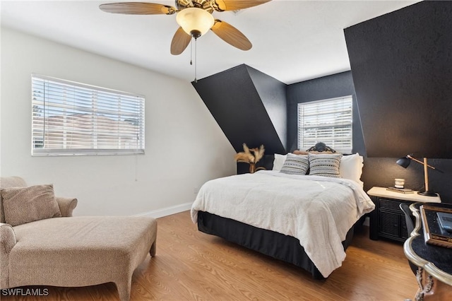 bedroom featuring light hardwood / wood-style floors and ceiling fan